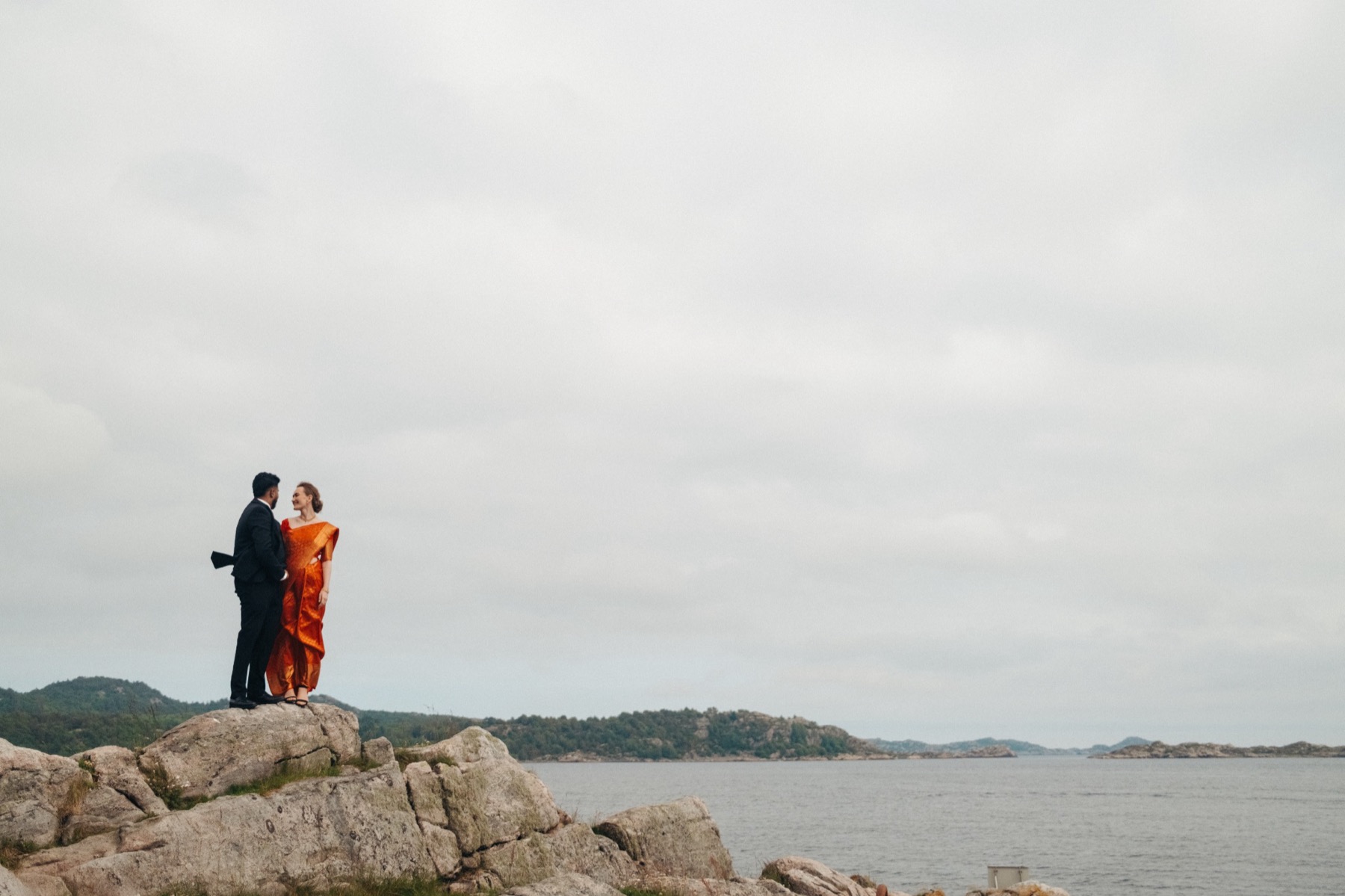Couple standing together in a coastal landscape