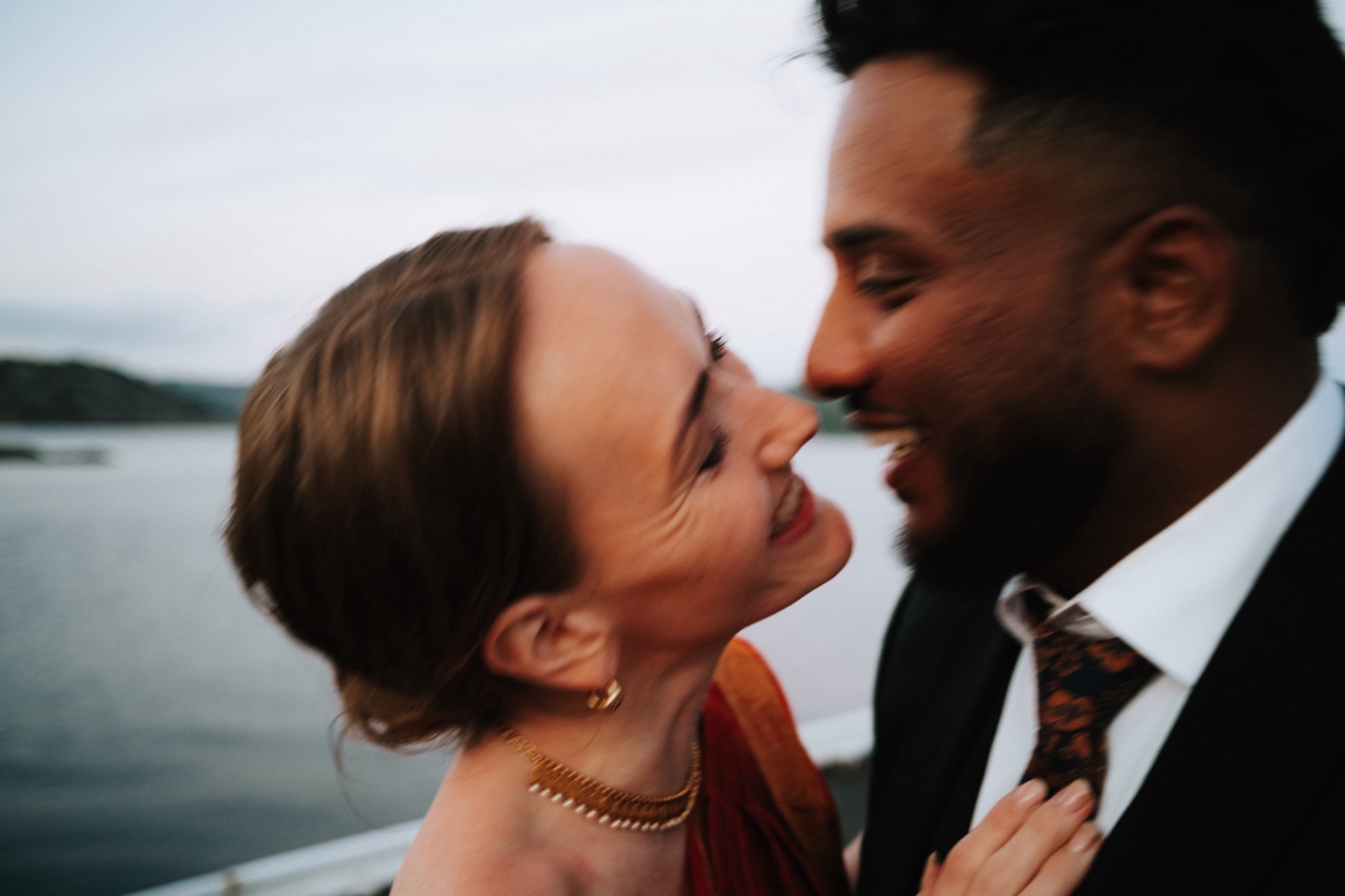 Wedding couple showing their rings at dusk